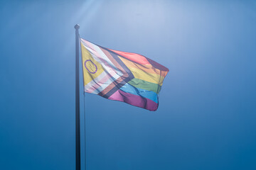 A Pride Flag against Clear Blue Sky