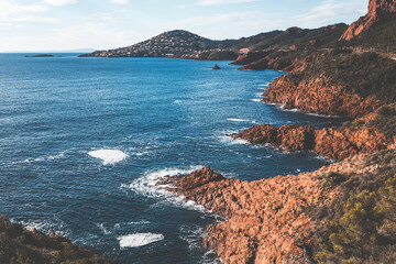 landscape of cap roux cliffs in french riviera on a winter day with pale sunlight