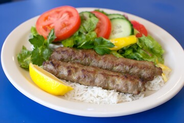 Kebab with rice and salad plate