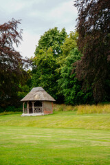 Garden seating hut surrounded by grass