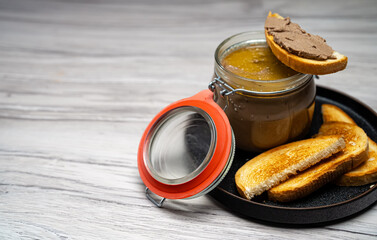 Rustic Homemade Liver Pâté in Glass Jar with Freshly Fried Buns.