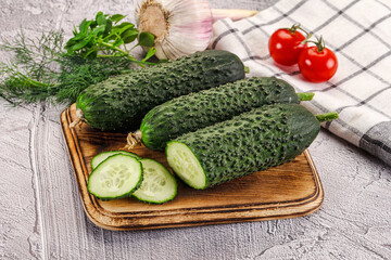 Raw green cucumbers with slices