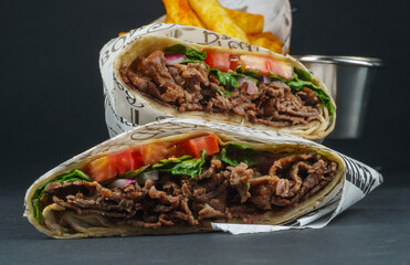 Delicious Beef Wrap Shawarma with Fresh Vegetables and French Fries
