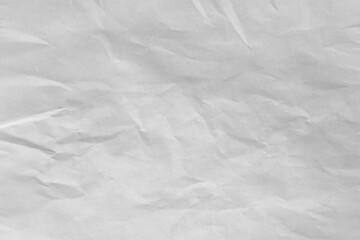 Crumpled white paper forming an abstract textured background