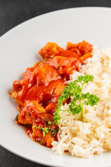 Rice butter chicken curry chicken tikka masala spicy meat in a bowl on the table fresh tasty gourmet food background on rustic food top view copy space