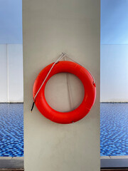 Red tires for swimmer safety on the pool wall