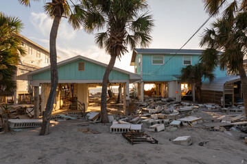 Ruined buildings in need of demolition or repair. Storm surge water and wind damaged houses roof and collapsed walls after hurricane in Florida