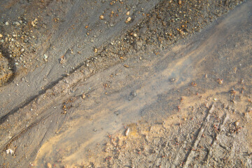  Dirty and muddy ground road in the nature at spring time.