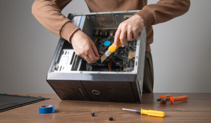 Caucasian master repairing computer. Computer maintenance