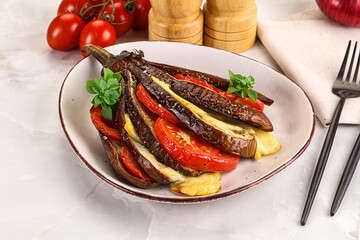 Baked tomato with mozzarella and tomato