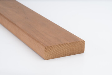 Brown hardwood board with rounded edge, displayed on white background. Smooth surface and solid structure ideal for carpentry or furniture making..