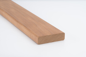 Brown hardwood board with straight edges and smooth finish, placed on white background. Suitable for carpentry, interior work, or furniture crafting..