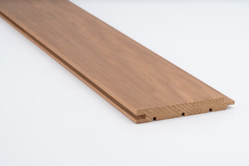 Brown wooden panel with detailed grooved design, photographed on white background. Ideal for wall cladding, furniture, or architectural trim..