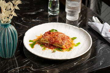 Portion of gourmet italian lasagna bolognese dish