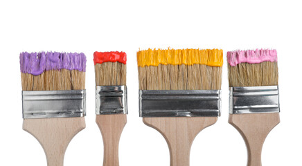 Brushes with different paints isolated on white