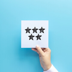 review rating and feedback concept. customer holding paper with very good satisfied review by give five star for service experience