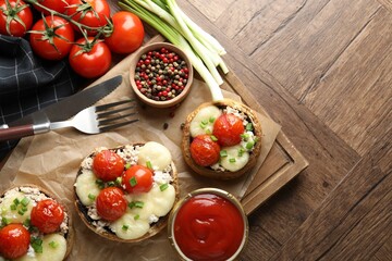 Tasty stuffed mushrooms served on wooden table, flat lay. Space for text