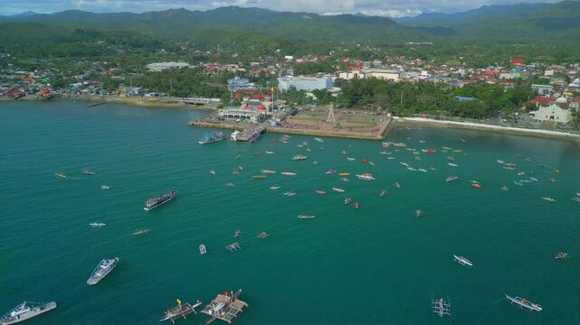 drone video of a busy port filled with bamboo boats