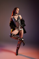 Elegant woman showcases striking fashion in a captivating castle core setting