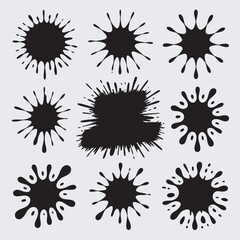 A collection of nine unique ink splatters, each with varying shapes and sizes, suitable for design elements or artistic expression.