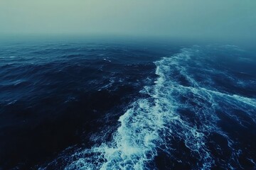 Dark, choppy ocean waves in mist