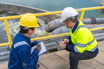 Environmental engineers work at wastewater treatment plants,Water supply engineering working at...