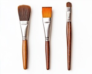Three paintbrushes, various styles, on a white background