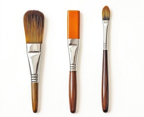 Naklejka premium Three paintbrushes, flat lay