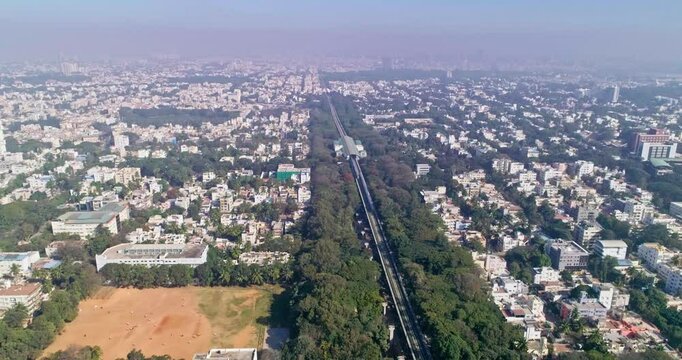 An aerial view of namma metro train moving on railroad track in bangalore,india, railway network