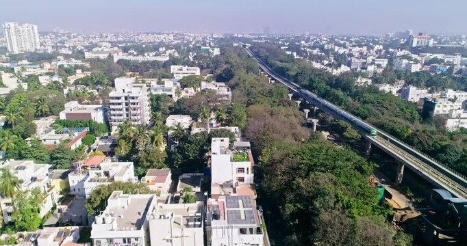 An aerial view of namma metro train moving on railroad track in bangalore,india, railway network