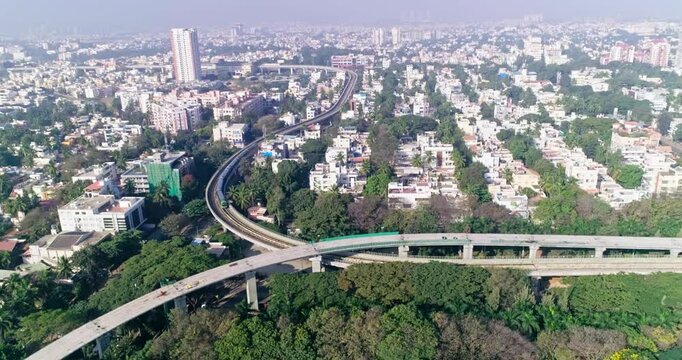 An aerial view of namma metro train moving on railroad track in bangalore,india, railway network