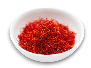 Fototapeta premium Bright red saffron threads in a small white bowl ready for culinary use in various dishes and recipes