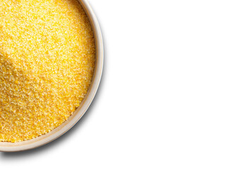 Fine yellow corn grits in a bowl, perfect for cooking and baking on a sunny afternoon in the kitchen