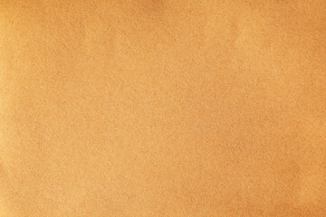 Crumpled craft brown paper material texture