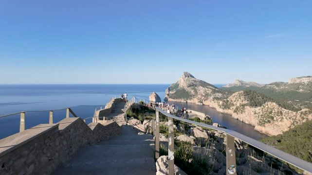 Breathtaking aerial view of the rocky coastline and deep blue sea from the es colomer viewpoint in mallorca, spain, on a sunny day