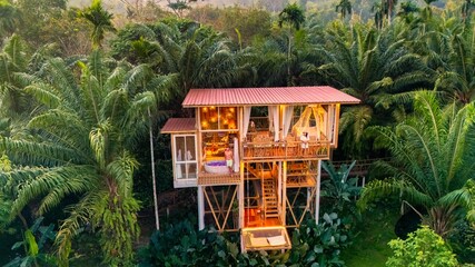 Unique treehouse retreat nestled high in lush jungle rainforest for a serene escape