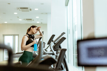 Workout session brings determination and sweat to a fitness enthusiast in a bright gym