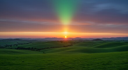 Fototapeta premium Sunset Over Rolling Hills and Green Landscape