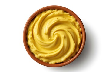 Fototapeta premium Top View of Creamy Yellow Dessert Swirl in Brown Bowl on White Backdrop Smooth Texture and Rich Color for Culinary Presentation and Sweet Treat
