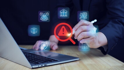 Digital security concept with warning notifications on virtual screens.Cybersecurity warning concept with digital alert icons and business person interacting with futuristic interface