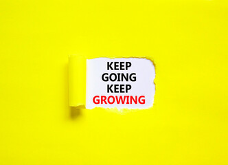 Keep going and growing symbol. Concept words phrase Keep going keep growing on beautiful white paper. Beautiful yellow paper background. Business motivational Keep going growing concept. Copy space.