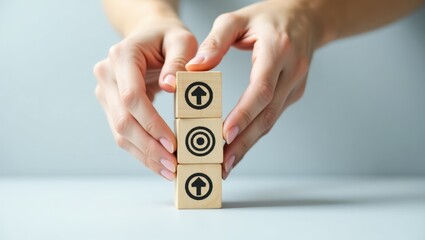 Wooden blocks with upward and target icons.