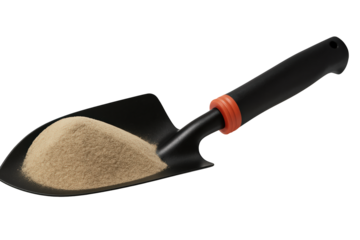 A black garden trowel filled with sand.