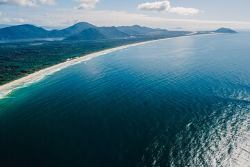 Beach, mountains and ocean in Brazil. Aerial view of Barra da lagoa village in Florianopolis