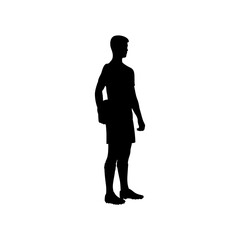 A football player is standing with a football in his hand silhouette .