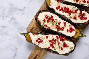 fried eggplant with sauce, decorated with microgreens and pomegranate seeds, eggplant appetizer, top view, homemade, no people,