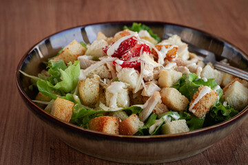 classic Caesar salad, close-up, natural light, selective focus, horizontal,