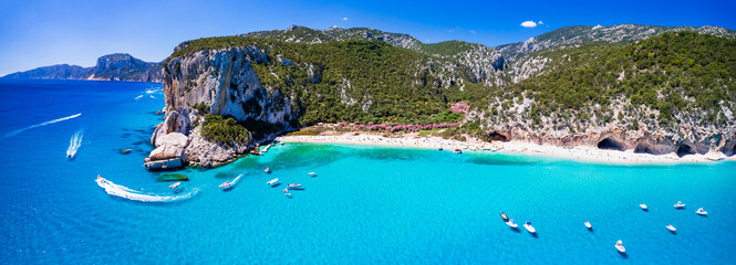 Best and most beautiful beaches of Sardegna island (Italy) - Cala Luna in gulf of Orosei a spectacular national park, Aerial panoramic drone view of white sandy beaches and turquoise sea