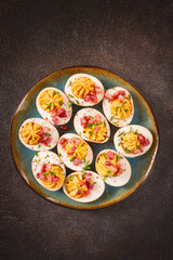 Spicy, stuffed ramen eggs, with bacon and green onions, homemade, no people,