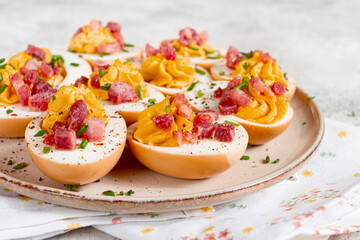 Spicy, stuffed ramen eggs, with bacon and green onions, homemade, no people,